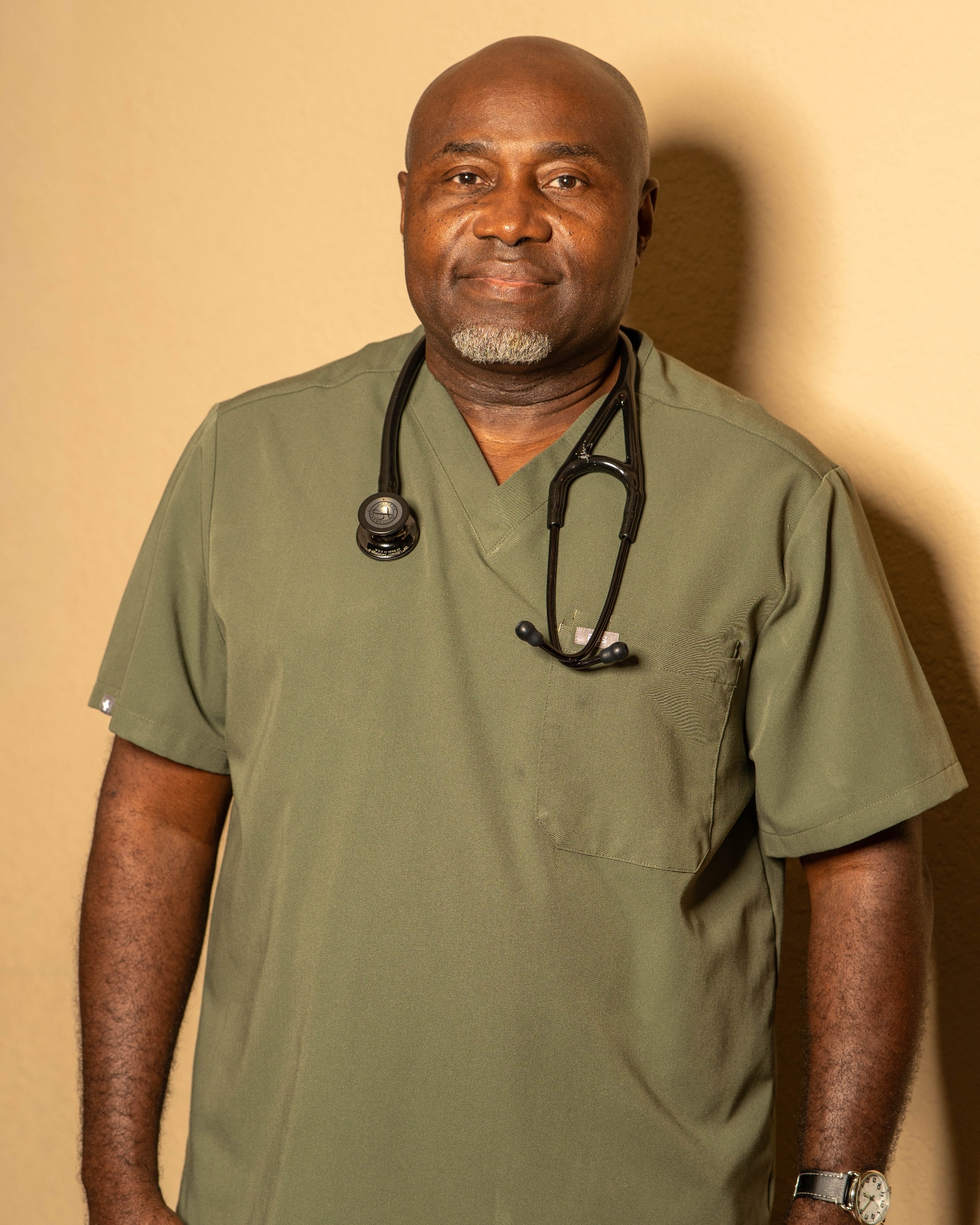 A professional home health care provider in scrubs with a stethoscope